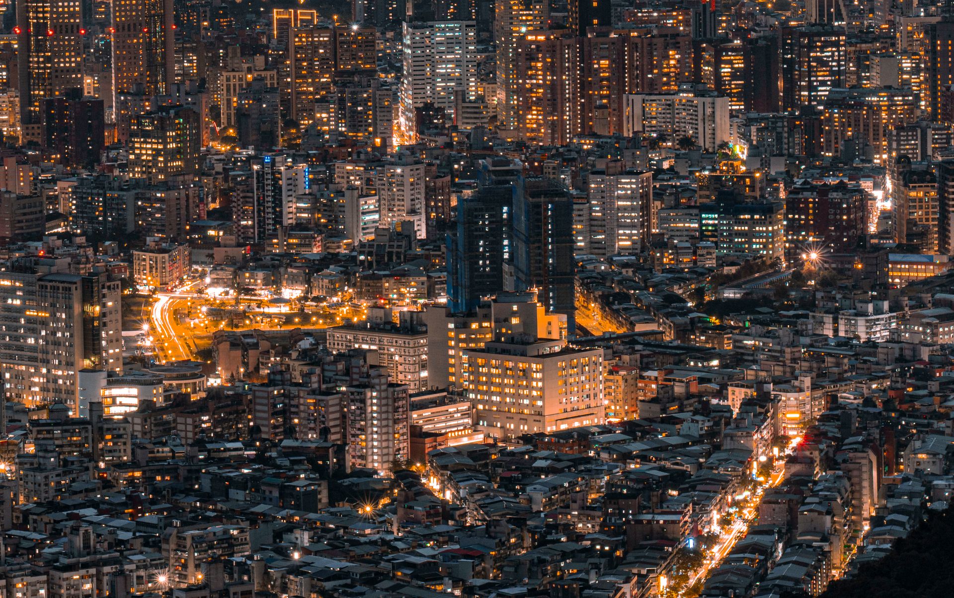 Dense city skyline glowing at night